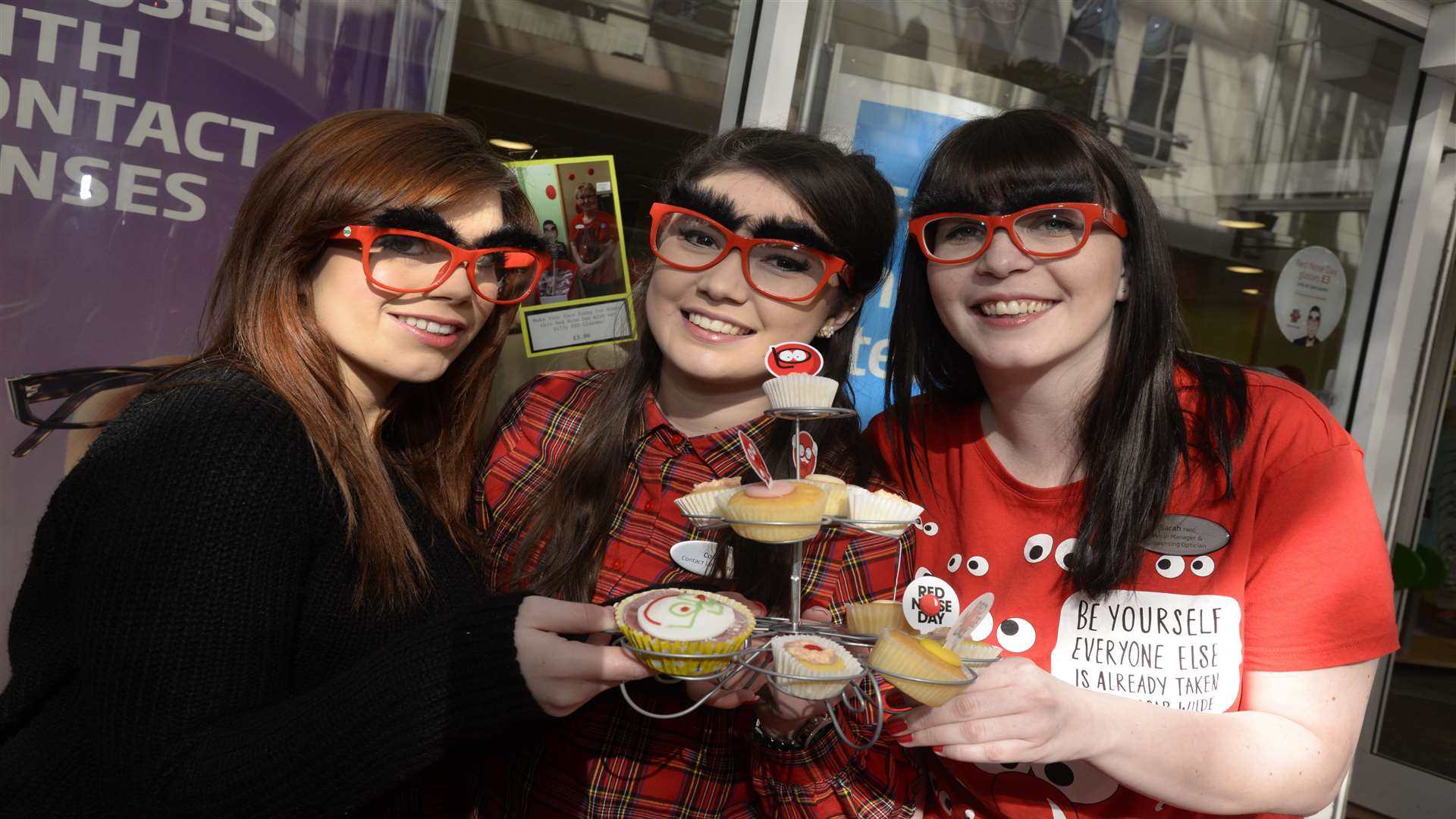 Kai Tuppen, Connie Davis and Sarah Gilliam busy selling cakes at Comic Relief Red Nose fundraiser