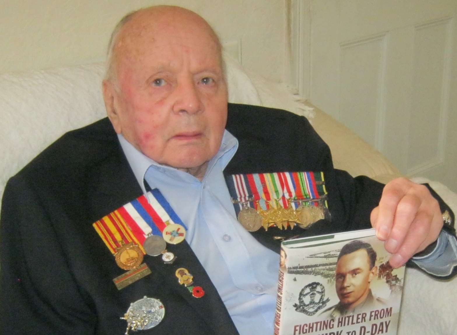 Jeff Haward with the book he has written of his wartime experiences.