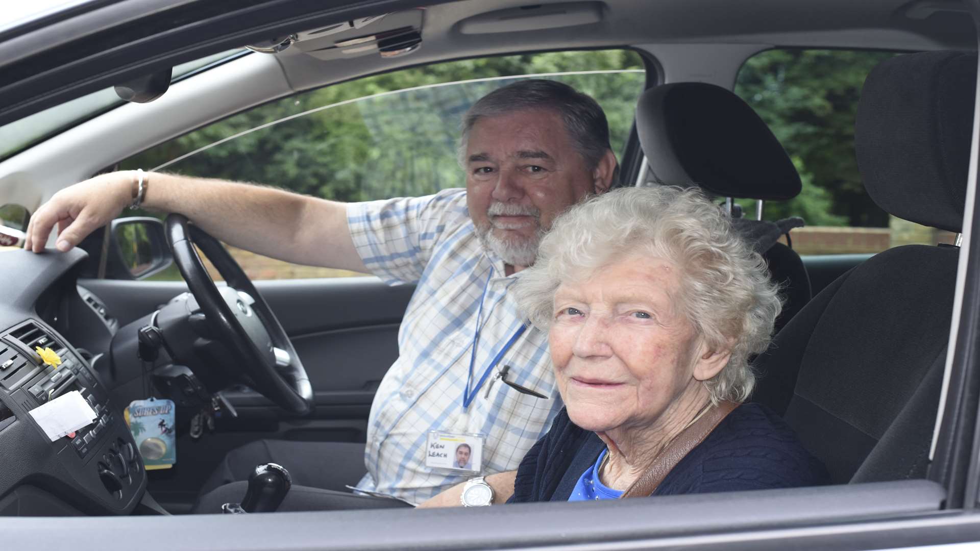 Driver, Ken, with transport service user, Lilly