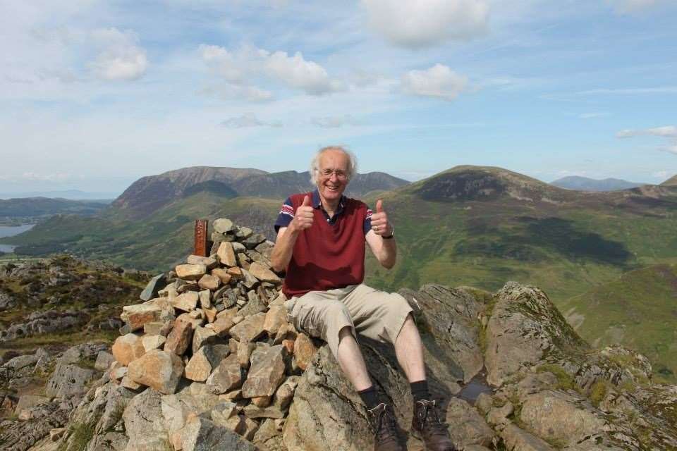 Clive Flisher sitting on the summit of Haystacks Hill in the Lake District