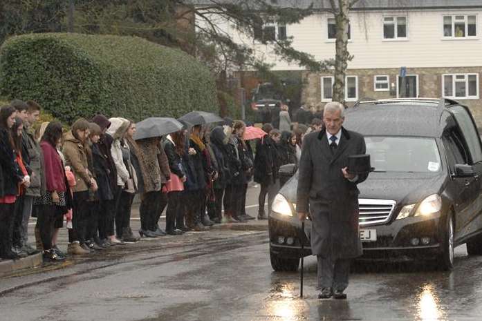 Mourners gather as the funeral procession for Zoe Georgiou passes