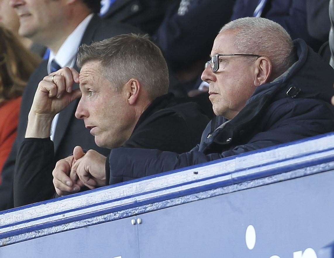 Current boss Neil Harris and Paul Scally watch the action from the stands. Picture: KPI