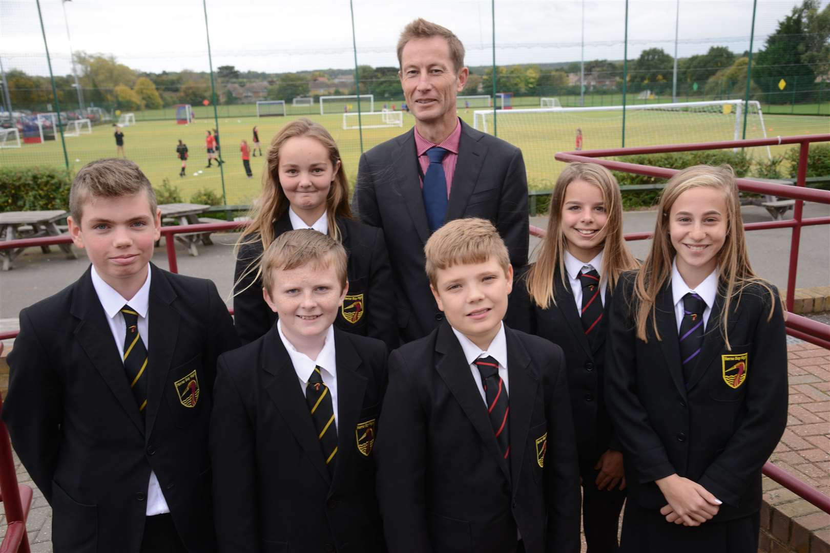 Herne Bay High principal Jon Boyes with a number of the school's pupils. Picture: Gary Browne