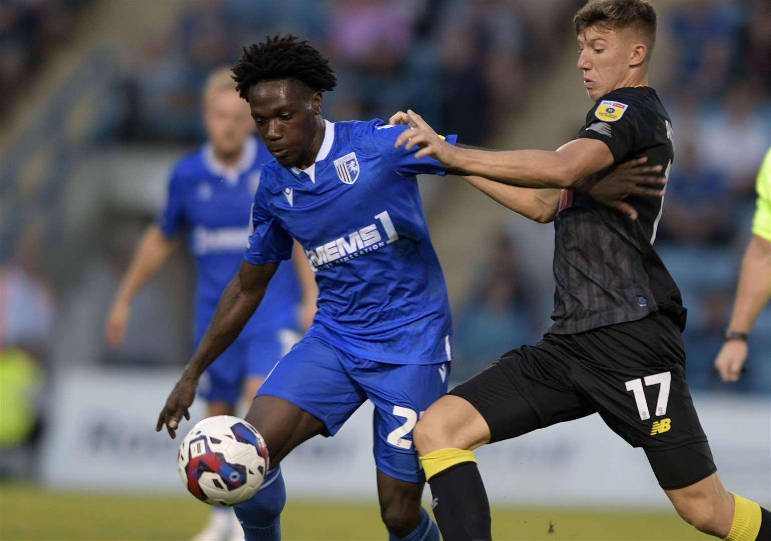 Gillingham winger Jordan Green takes on Harrogate's Josh Austerfield on Tuesday night during Gills' loss. Picture: Beau Goodwin