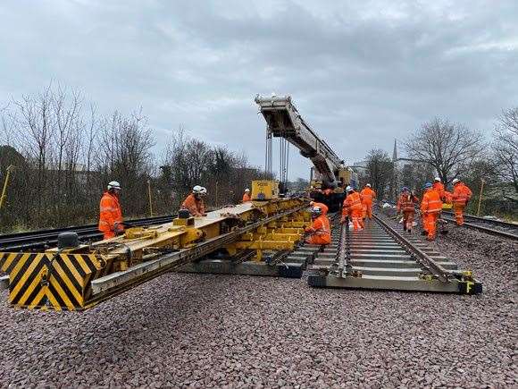 Network Rail engineers laying down tracks. Picture: Network Rail.