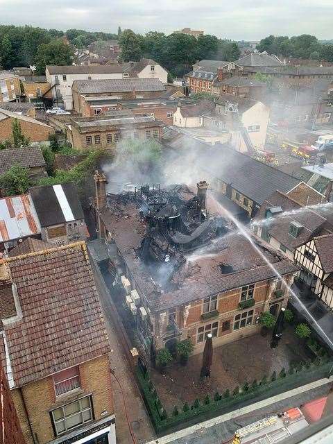 Firefighters tackling the blaze at Mu Mu in Maidstone's Week Street from above. Picture: Petra Kovacsova
