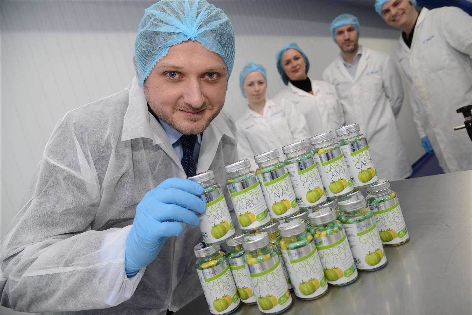 Lee Smith with some of the diet pills made at the Forza Supplements factory in Javelin Enterprise Park, Ashford