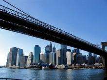 Manhattan skyline framed by the Brooklyn bridge, New York