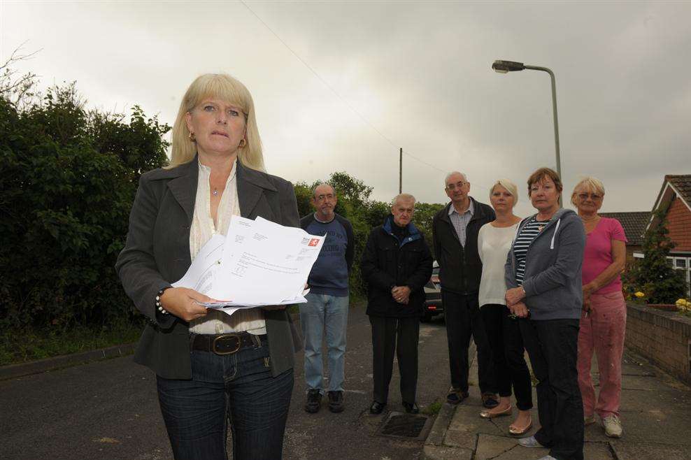 Tina Brooker with letters to the council and angry residents.