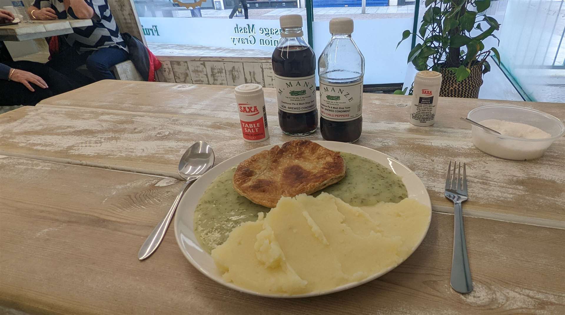 Sitting down to pie and mash at Betty's