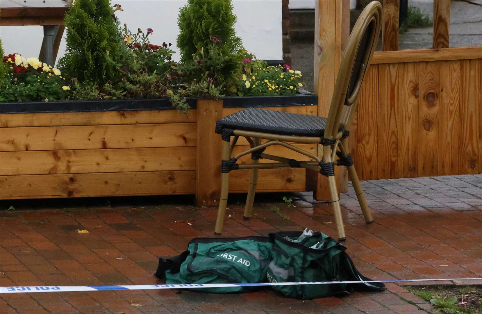 First aid bag is next to a chair outside the pub. Picture: UKNIP