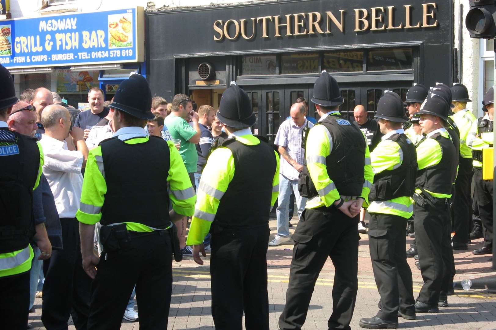 Gillingham and Swindon fans kept apart by Police during a meeting between the sides in 2009 Picture: Jenni Horn