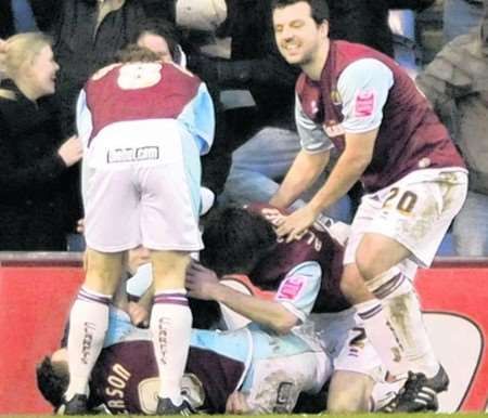The Burnley players are ecstatic after their injury-time winner. Picture: Barry Goodwin