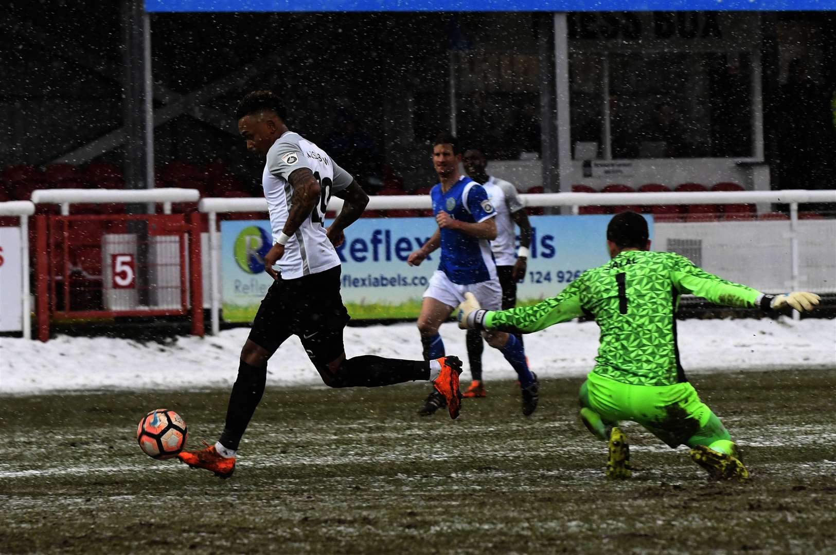 Keanu Marsh-Brown shoots and scores the second goal for Dover against Macclesfield .Picture: Tony Flashman (1209310)