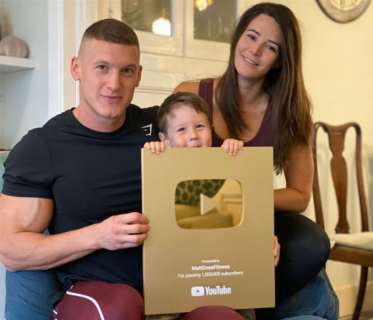 Matt Morsia, wife Sarah and son Luca with a plaque sent by YouTube after he gained a million subscribers to his channel