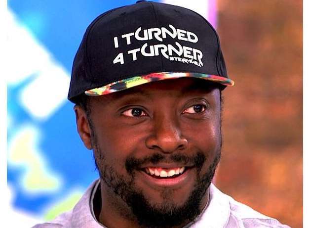 will.i.am wearing his 'I Turned 4 Turner' cap