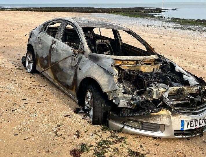 The burn-out car was seen at Walpole Bay in Margate today. Picture: Naomi Gale