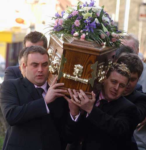 Hayden Waller's father (left) helps carry his son's coffin into church. Picture: BARRY CRAYFORD