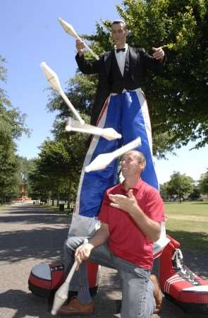 Victor Pilipovich recaps his juggling skills with Moscow State Circus stilt man and clown Valeriy Kashkin. Picture: Gary Browne