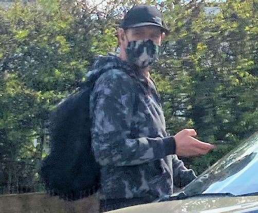Robb tried to conceal his identity by wearing a baseball cap, hooded top and camouflaged face mask. Picture: Kent Police