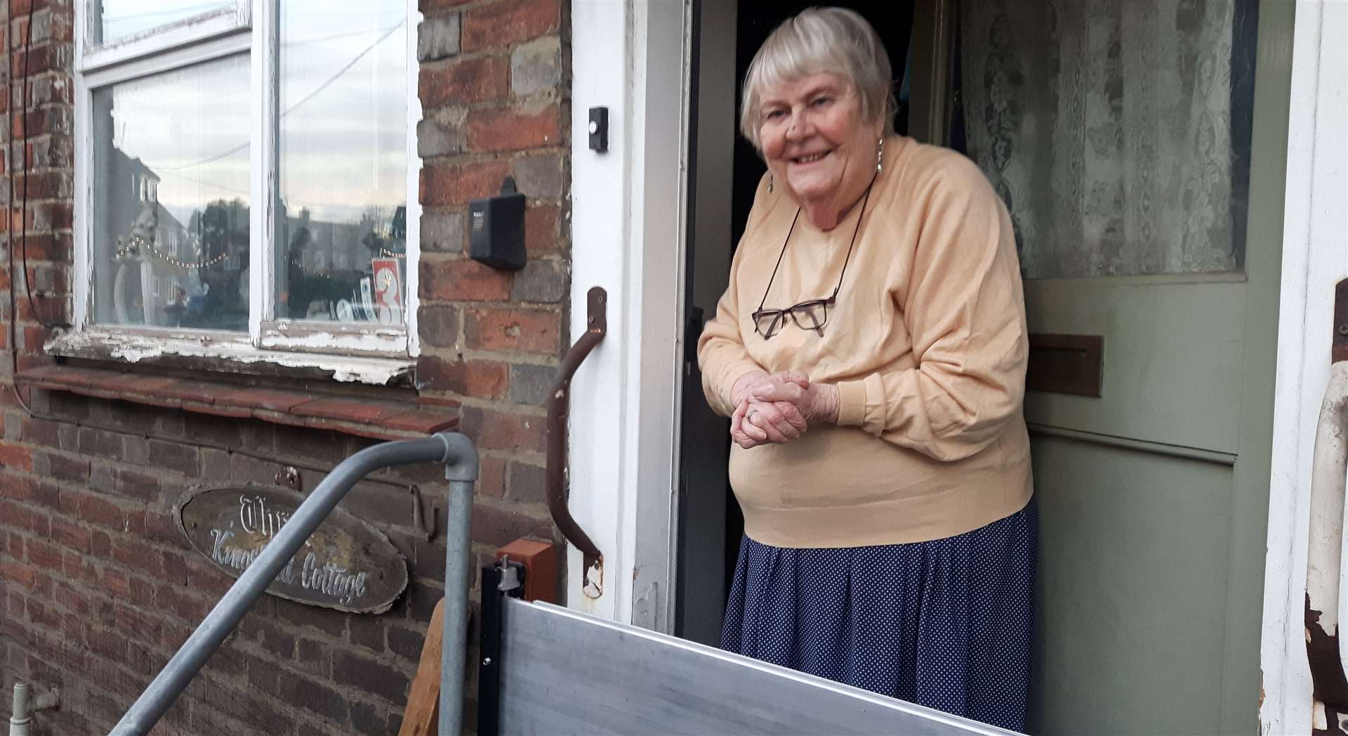 Rusty Morris, who is staying put in her home and has had a flood gate installed over her front door