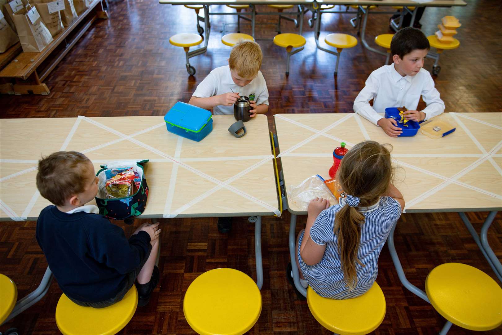 Children eat lunch in segregated positions at Kempsey Primary School in Worcester (Jacob King/PA)
