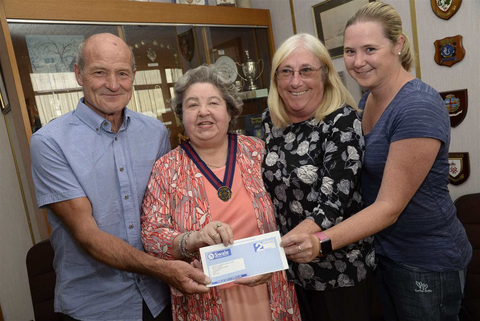 Former Swale Mayor Cllr Anita Walker presents a cheque to Bob, Joan and Lauren McCall of the Sheppey Carnival Association. Picture: Chris Davey