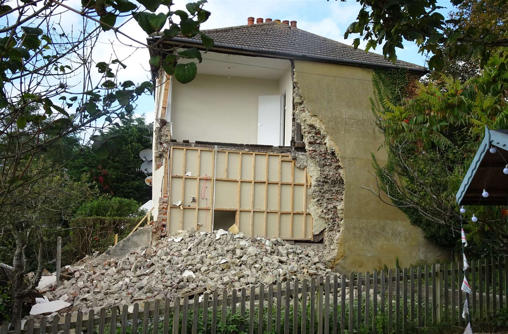 The scene after part of a house collapsed in Hythe