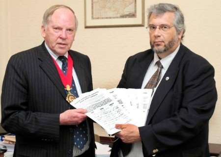 Deal county councillor Mike Eddy hands over the A258 petition to outgoing county council chairman Cllr Leyland Ridings