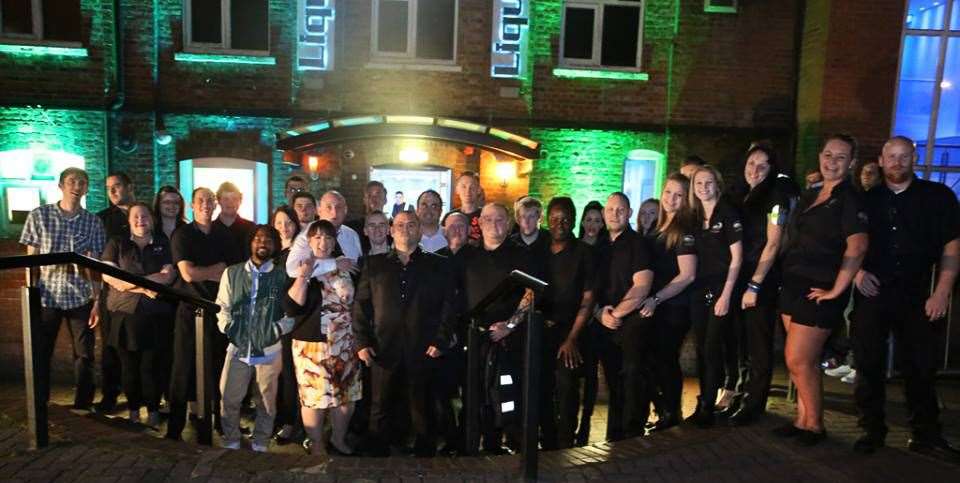 Staff gathered outside the nightclub before shutting the doors for a final time. Picture: Alvin Mulindwa