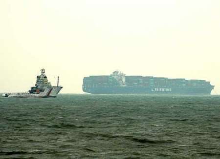 A tug stands by near the container vessel off the coast of Kent. Picture courtesy Robert Riddle