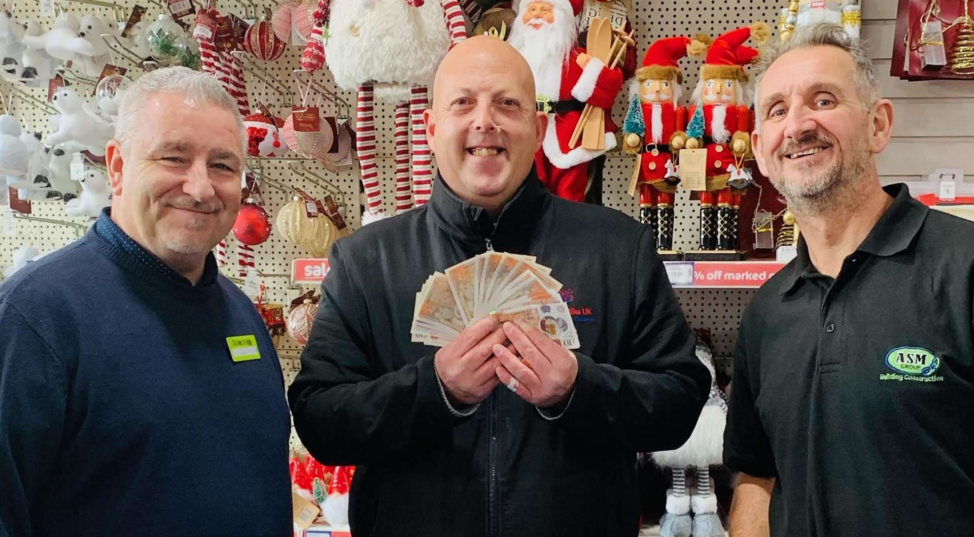 The handing over of one of the biggest donations after the theft. From left: Wayne Richardson, Luke Shaw of United Families, and Andrew Morley. Picture: The Original Factory Shop