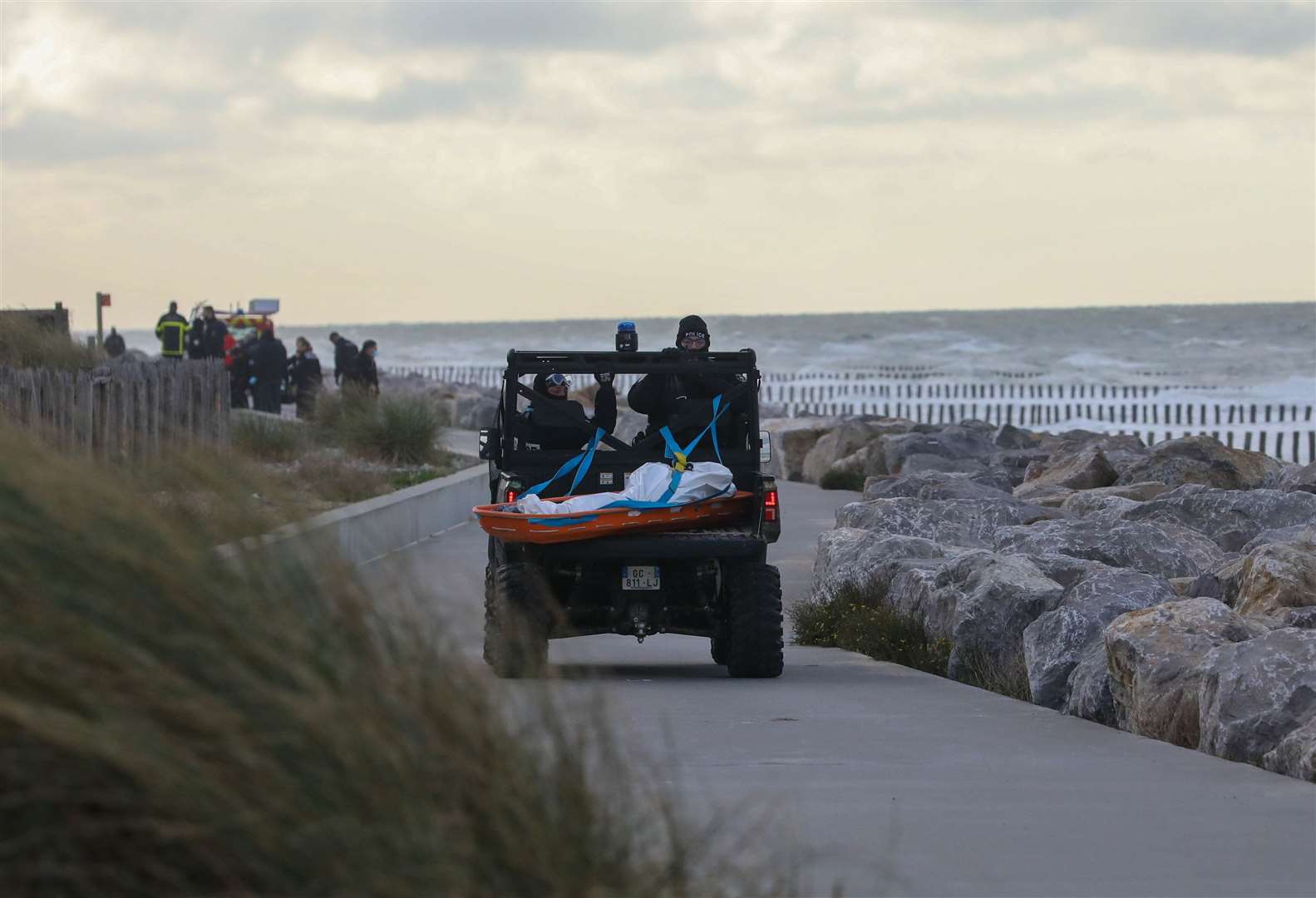 The body of an asylum seeker is recovered from a beach in France Picture: UKNIP