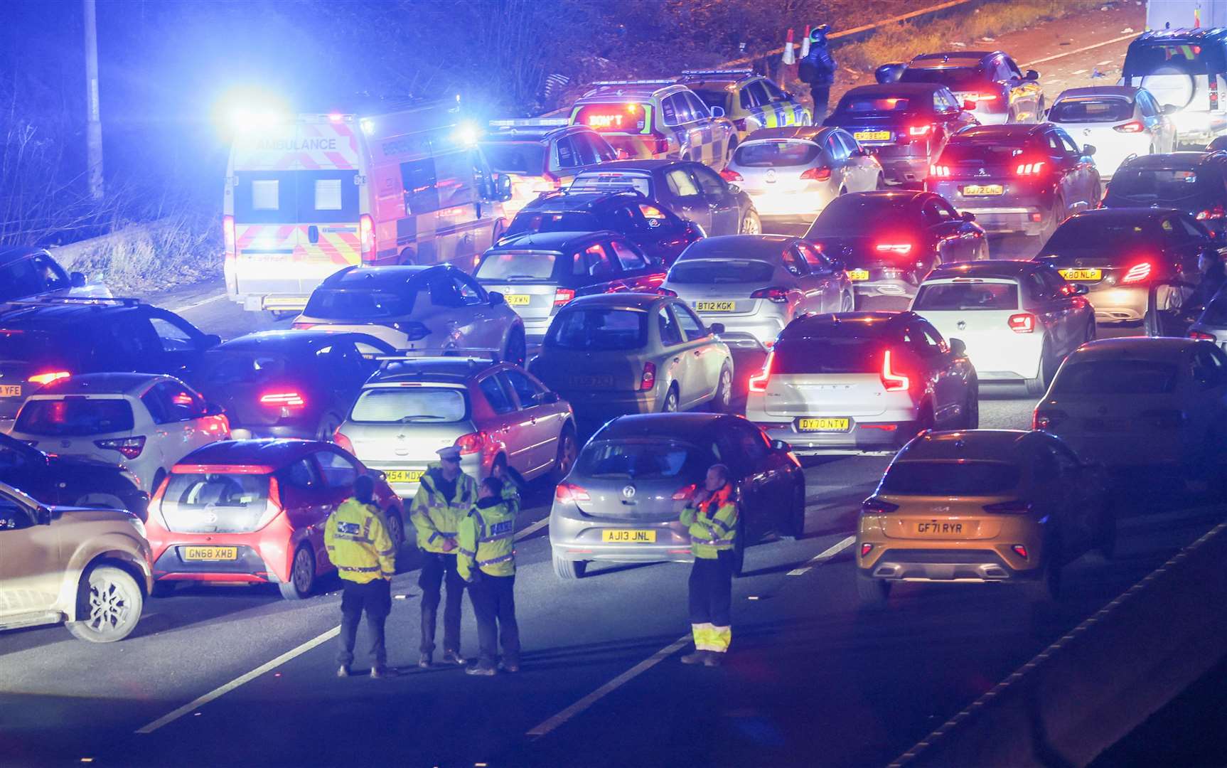Officers at the scene of the crash on the A2. Picture: UKNIP