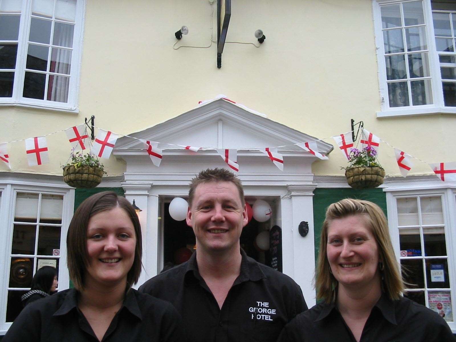 The George Hotel's landlord Tom Dixon with barmaids Corinna Anderson, left, and Tracey Powell in 2008