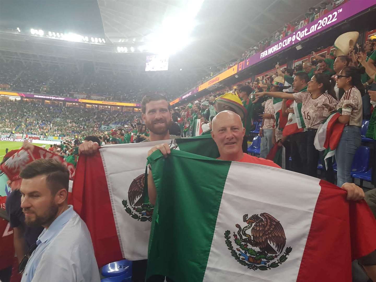 Terry and his son Jordan cheering on Mexico in their Group C clash with Poland. Photo: Terry Matson