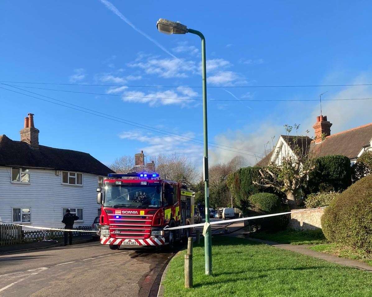Smoke can be seen coming from the house. Picture: Neil Matthews