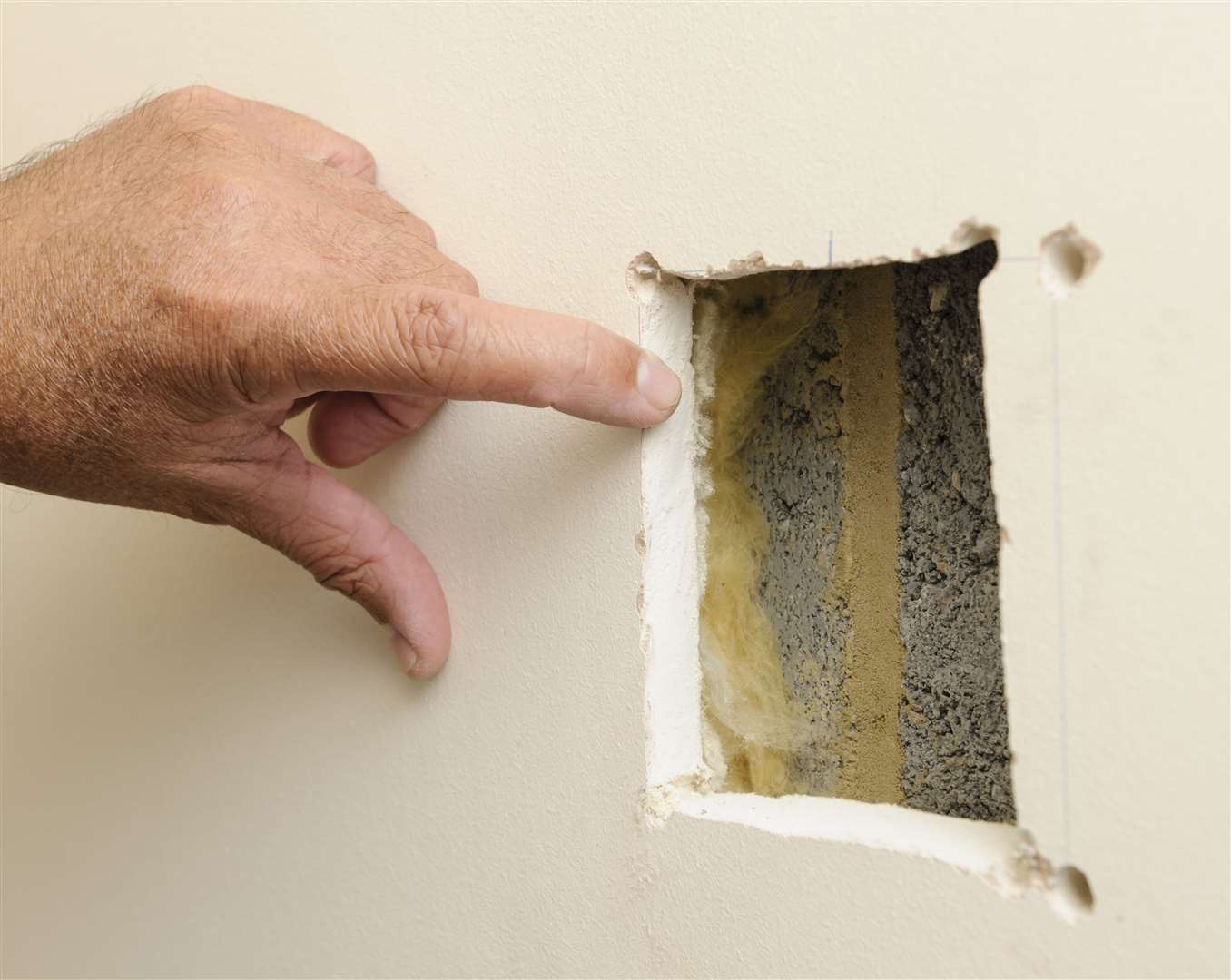 Jose Bolou made his own inspection hole to examine the wall's construction
