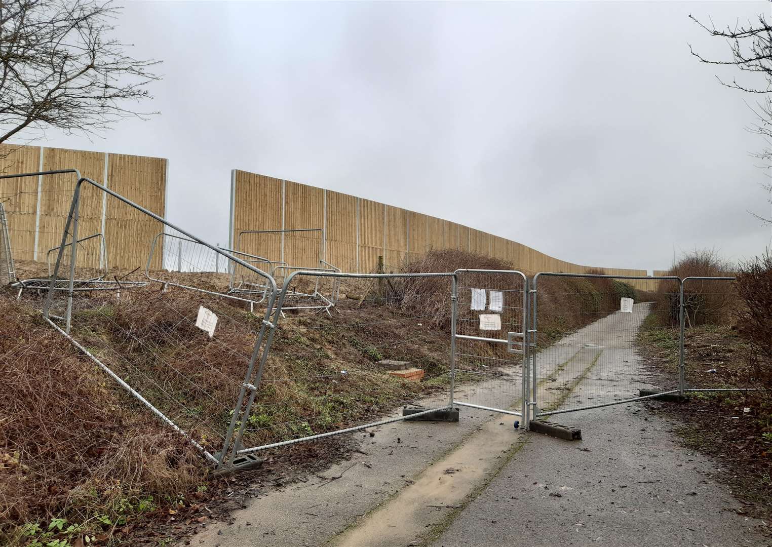 A huge fence at the edge of the site in Highfield Lane