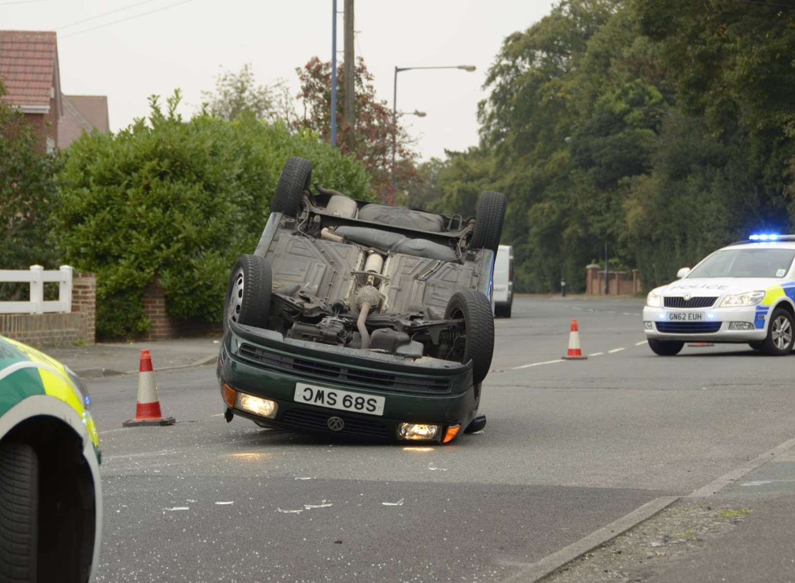 A car was flipped over after an accident in Singlewell Road