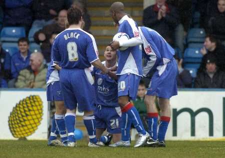 The Gillingham players congratulate Matt Jarvis after winning the penalty. Picture: GRANT FALVEY