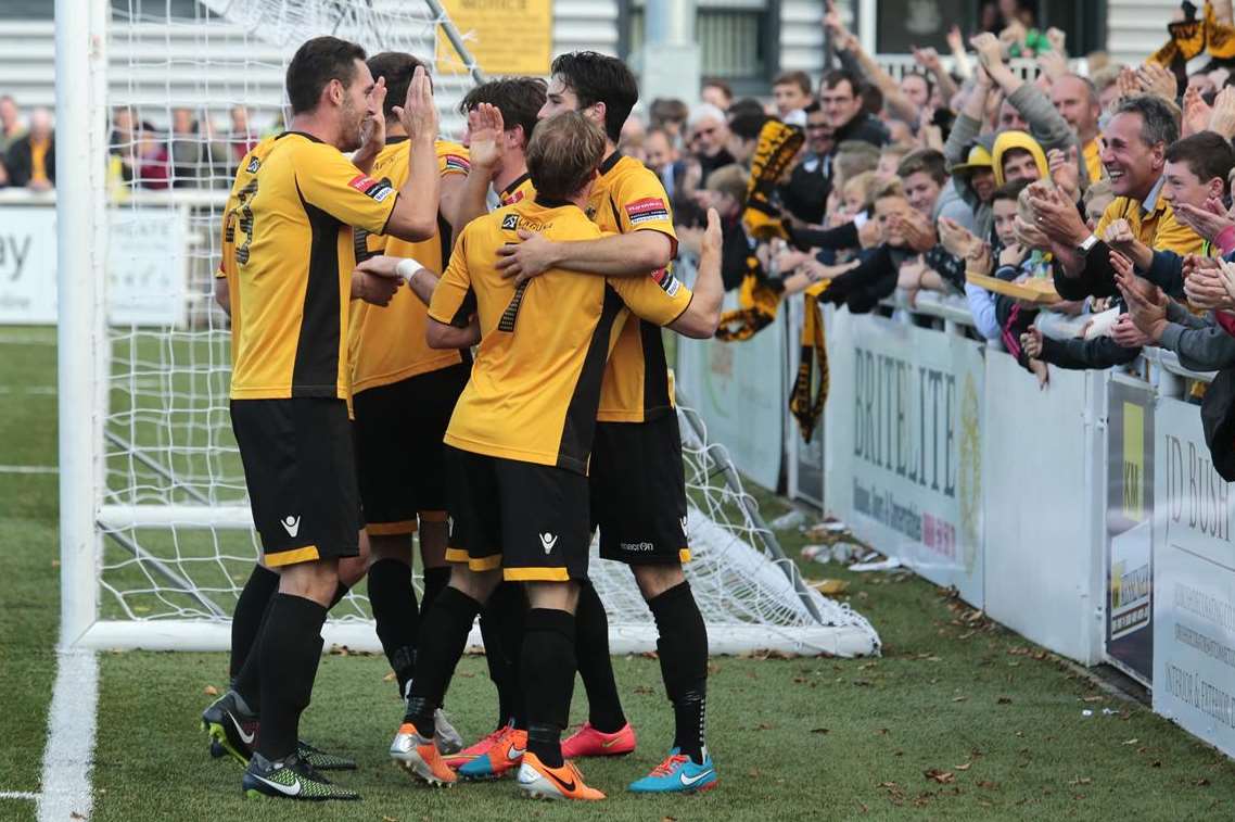 Maidstone players and fans celebrate Frannie Collin's FA Cup winner against Welling Picture: Martin Apps