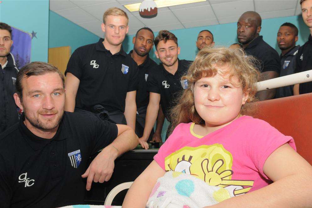 Dolphin Ward, Medway Maritime Hospital, Gillingham. Gills football squad visit the children. Tammy Stanton (8) and Danny Kedwell