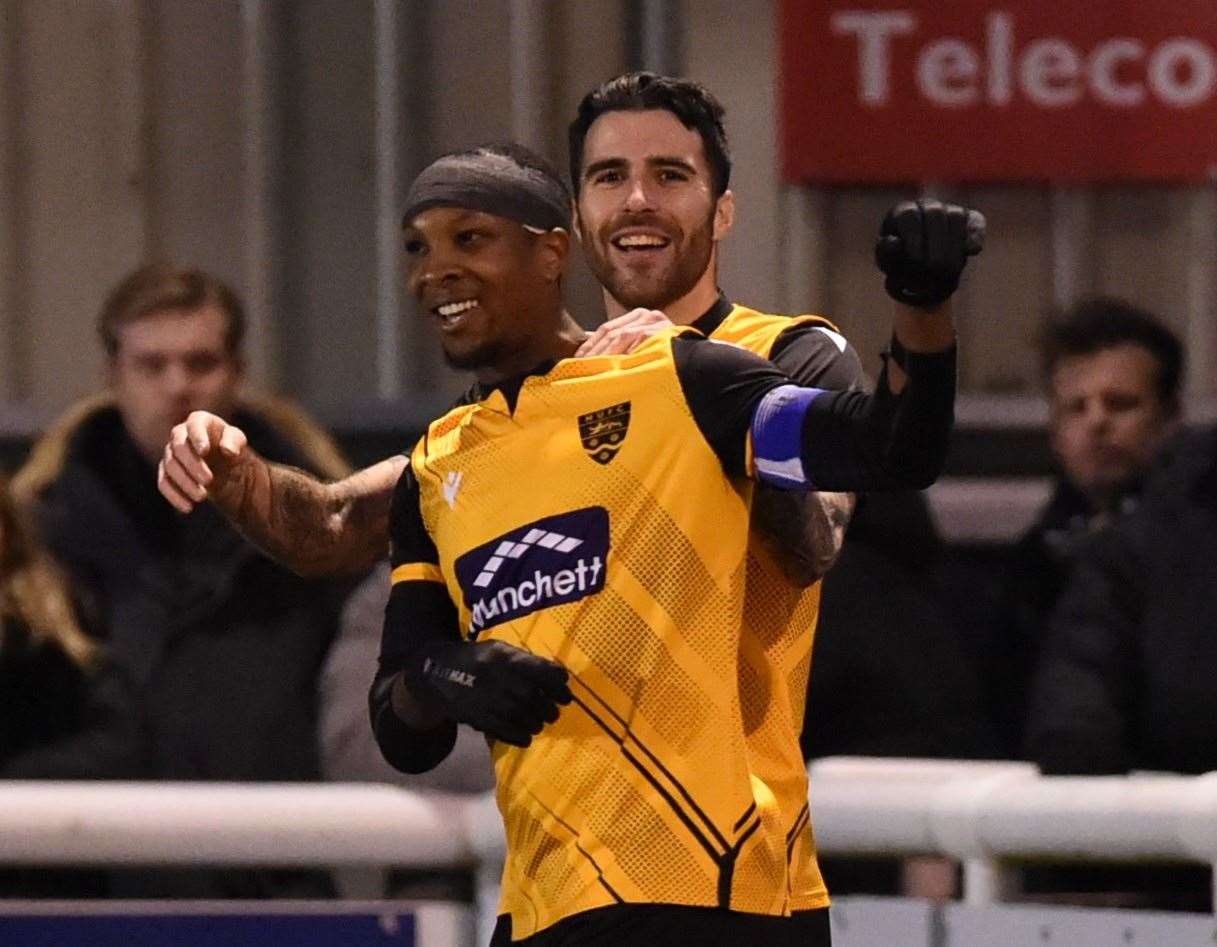 Maidstone skipper Gavin Hoyte is congratulated on his goal by Joan Luque Picture: Steve Terrell