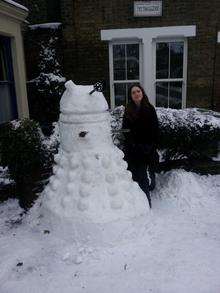 13-year-old Daisy Fry with her snow Dalek in Forbes Road, Faversham.