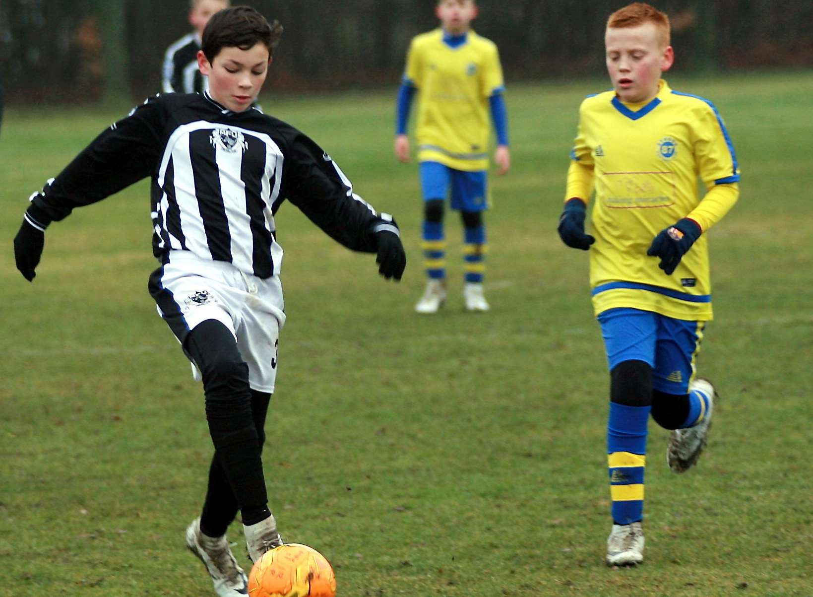 Milton & Fulston United under-12s in possession against Strood 87 Picture: Phil Lee