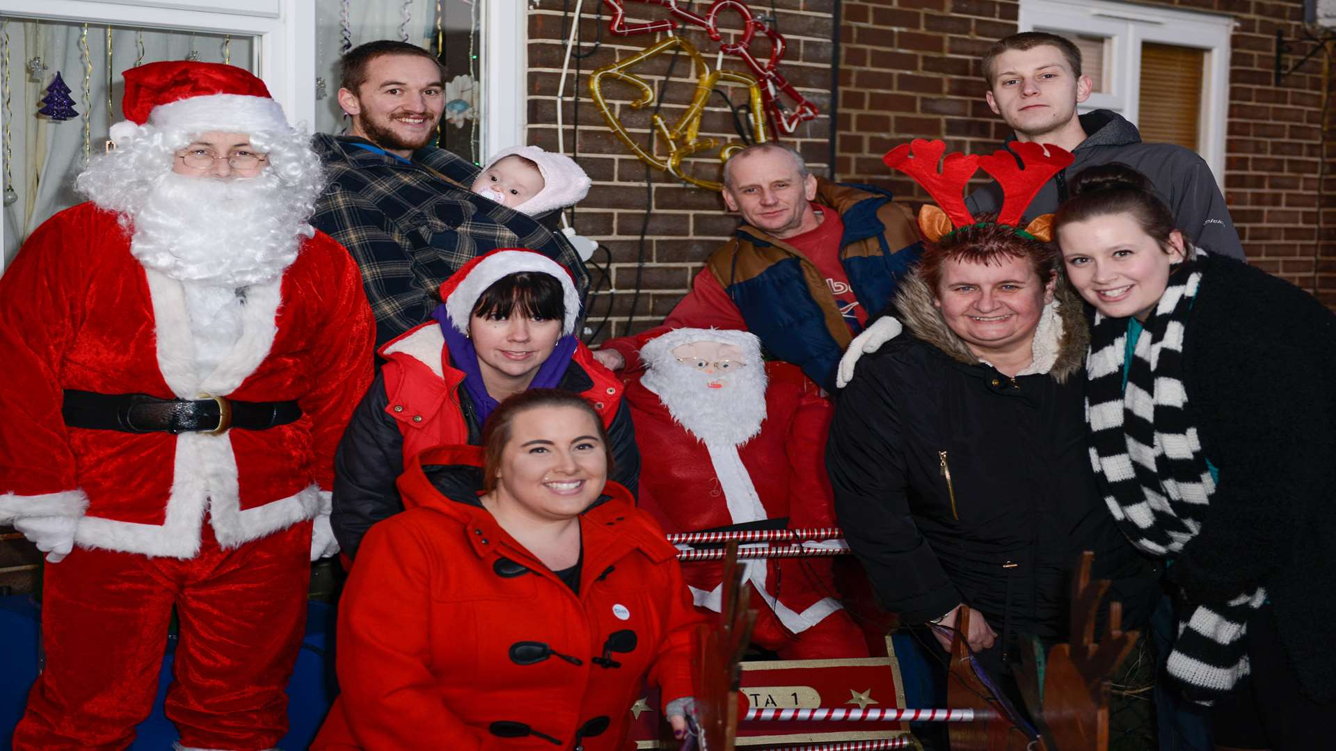 Lee Curry dressed as Santa with Stephanie, Angie, Lee, Samantha Curry and Jacob Townsend, Dean Mossop and Becky Loftus