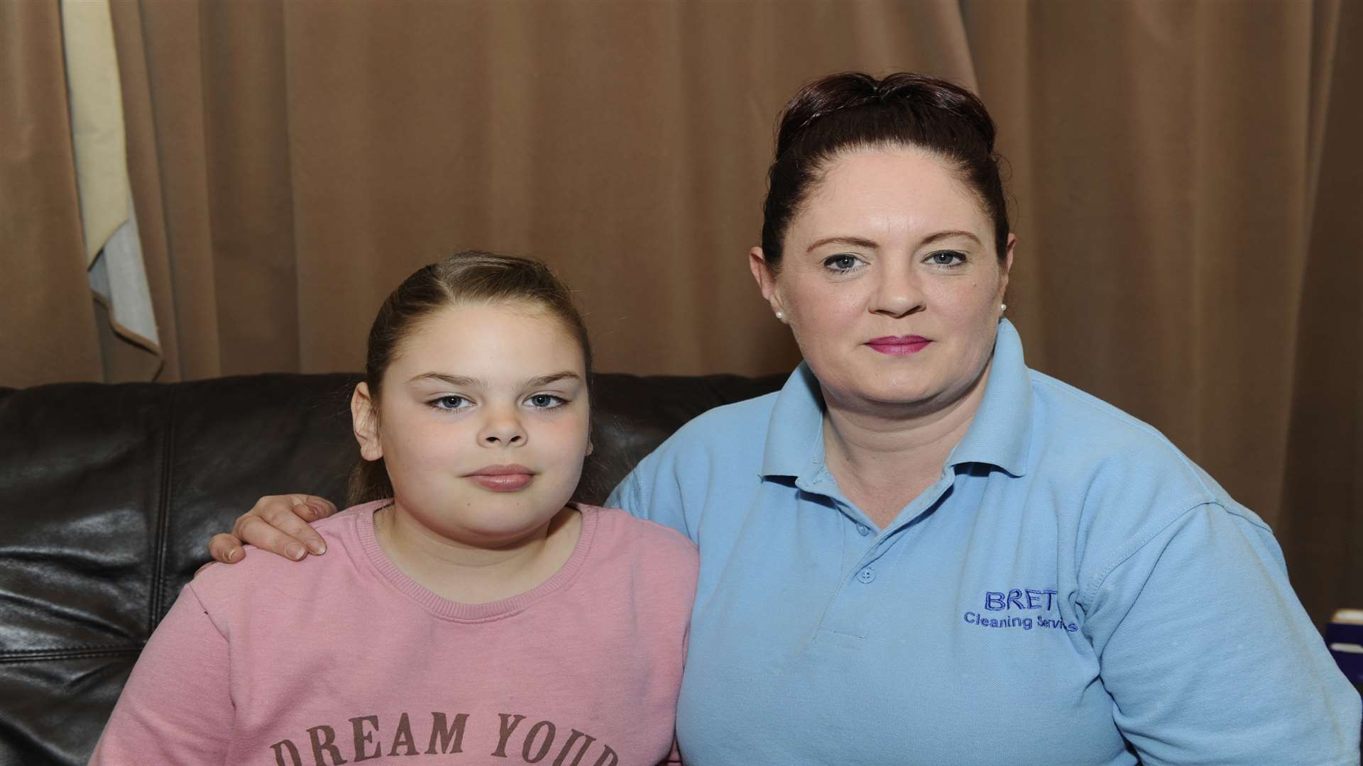 Olivia Brett, eight, split her lip open on a stretch of uneven paving. Pictured with mum Martine Brett