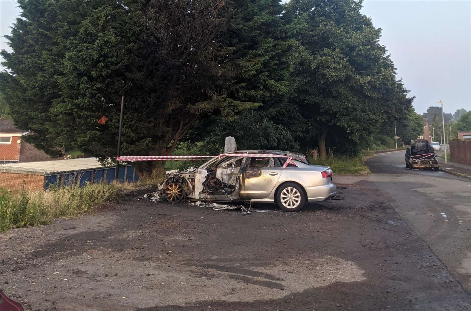 The wreckage of torched cars in Bishops Way, Canterbury