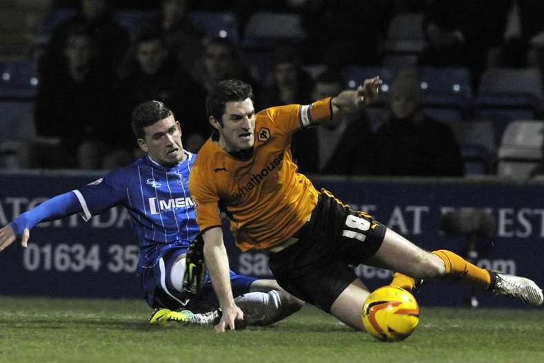 Cody McDonald challenges Wolves captain Sam Ricketts Pic: Barry Goodwin